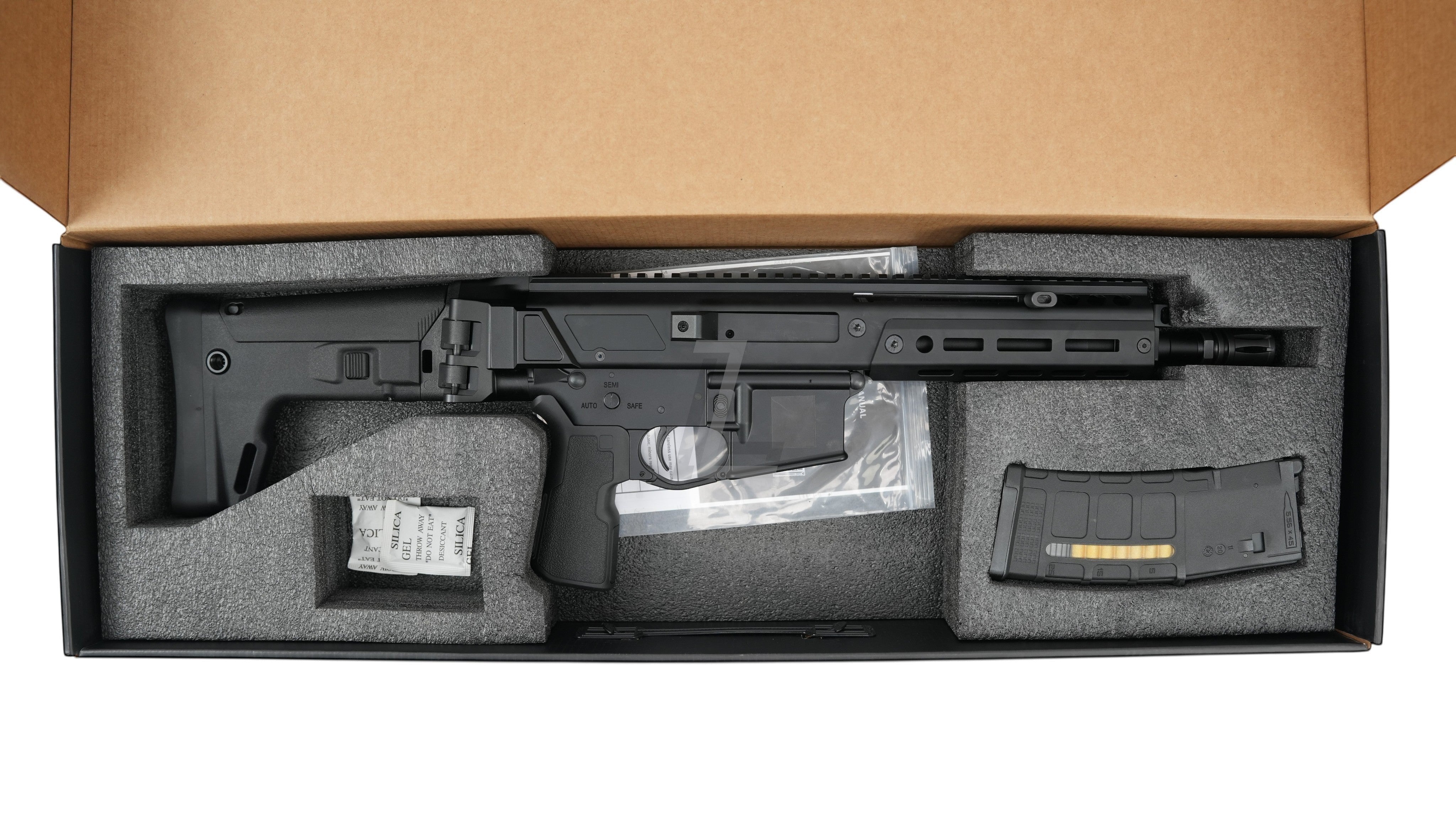 Landing Zone Double Eagle DWS Lupus 8.5 GBB airsoft rifle in black, stored in a protective foam-lined box with magazine.