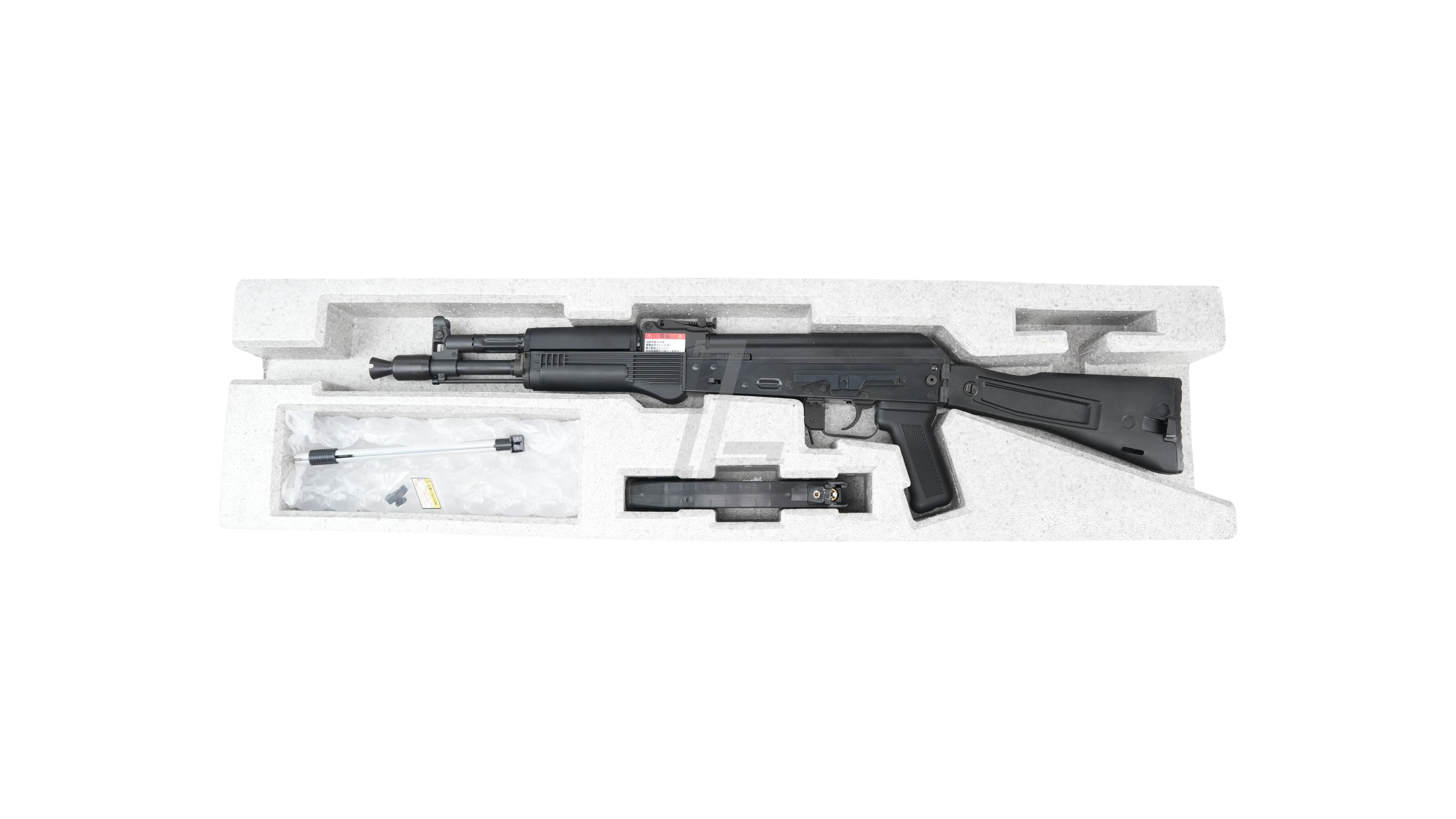 Landing Zone GHK AK105 V3 gas blowback airsoft rifle in black, displayed in its original protective foam packaging.