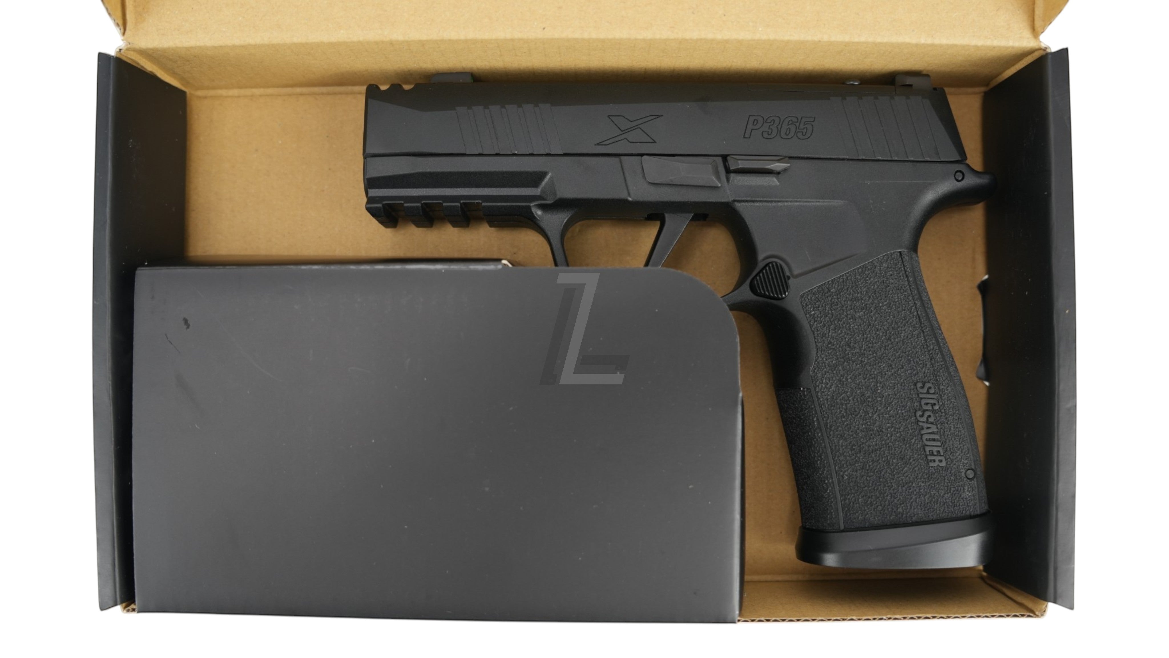 Landing Zone PARA BELLUM P365 X-MACRO COMP GBB airsoft pistol in black, displayed inside its original packaging.