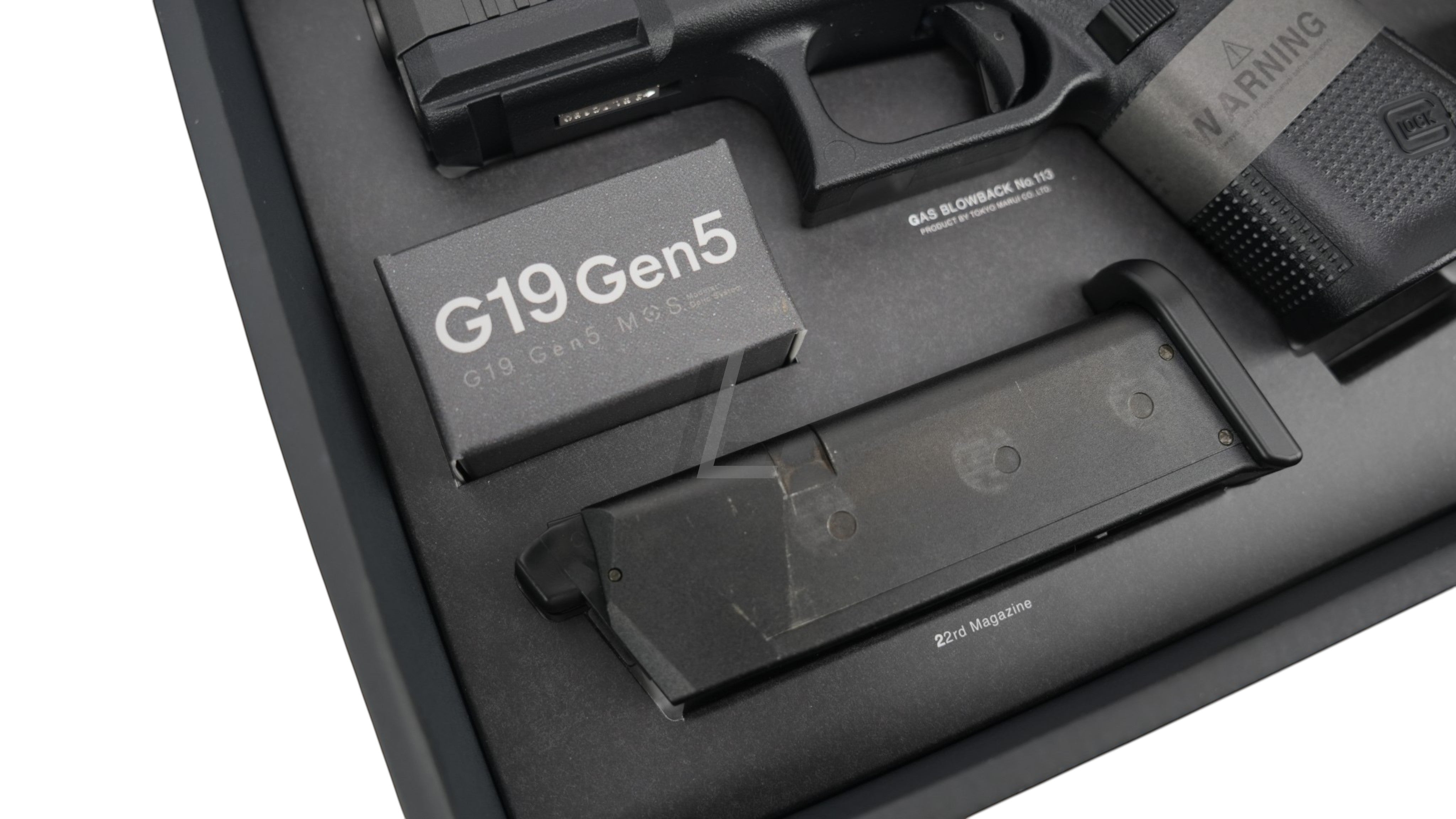 Landing Zone Tokyo Marui G19 Gen5 MOS GBB pistol with 22-round magazine and product box.